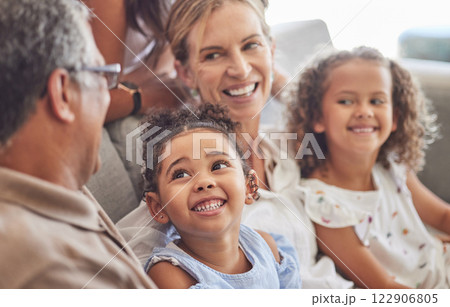 Happy, smile and family relax on living room couch and talking, conversation and doing a catch up. Love, diverse grandparents and grandchildren bonding, fun and quality time in family home together. 122906805