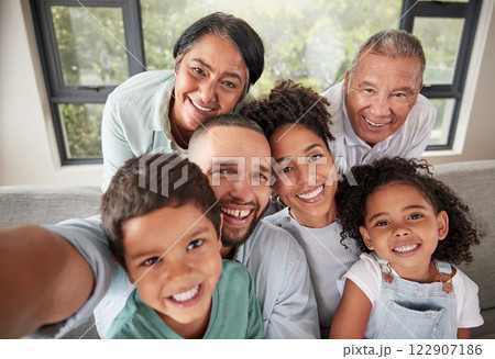 Selfie, family and children with kids, parents and grandparents taking a photograph at a visit in their home. Face, happy and smile with a grandmother, grandfather and relatives posing for a picture 122907186