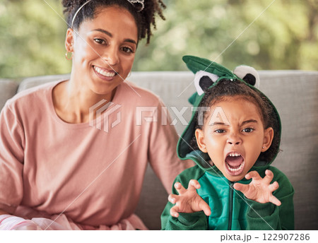 Portrait of mother and child playing, having fun with costume and bonding on a sofa at home. Fantasy, game and creative parent enjoying a playful activity with her daughter, smile and relax together 122907286