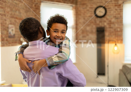 Dad and son hugging and looking happy and enjoyed 122907309