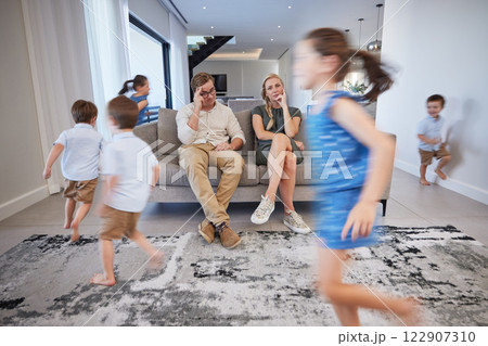 Kids running, mother and father on sofa tired and chaos in living room. Frustrated parents burnout, happy children and parenting stress. Excited girl and boy with energy play, woman and man in crisis Kids running, mother and father on sofa tired and chaos in living room. Frustrated parents burnout, happy children and parenting stress. Excited girl and boy with energy play, woman and man in crisis 122907310