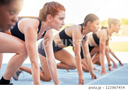 Running competition, sports start and women in marathon race for fitness at stadium, determined to win and power for cardio event together. Focused and young runner athlete group ready for challenge 122907454