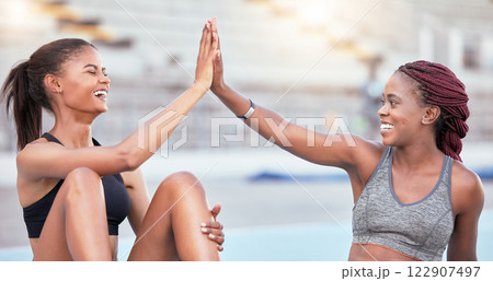 Support, high five and black woman running team winner at athlete practice in stadium. Congratulations, motivation and success at workout training with happy and joyful fitness friends. 122907497