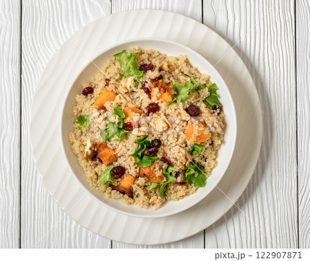 quinoa pumpkin salad in a bowl, top view 122907871