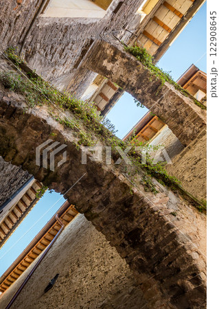 The winding narrow streets, stairs and charming architecture of Spoleto 122908645