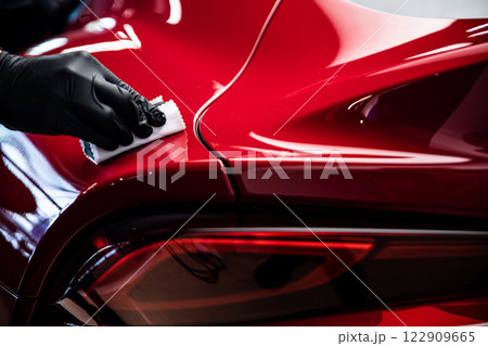 Ceramic or graphene coating on red paint ensures vibrant color deep gloss Ceramic or graphene coating on red paint ensures vibrant color deep gloss 122909665