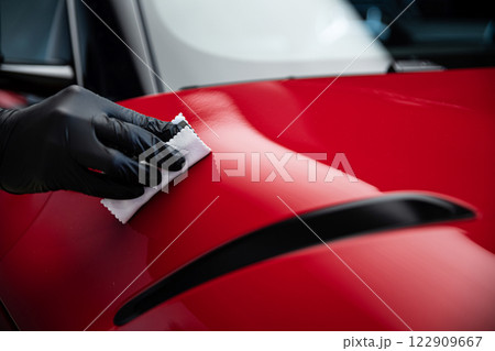 Ceramic or graphene coating on red paint ensures vibrant color deep gloss  122909667