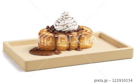 Mocha mousse croissant French toast with layers of soft, buttery croissants soaked in a rich mocha mousse custard and lightly 122910134