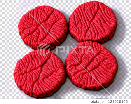 A close-up of raw ground beef patties being seasoned with salt and pepper. The beef is finely textured, slightly moist, A close-up of raw ground beef patties being seasoned with salt and pepper. The beef is finely textured, slightly moist, 122910146