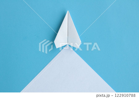 Top view of white paper airplane with customizable space for text Top view of white paper airplane with customizable space for text 122910788