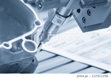 The automatic glue sealing process by robotic arm in the light blue scene. The automatic glue sealing process by robotic arm in the light blue scene. 122912266