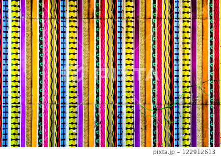 A striking mural of yellow, pink, blue, and black stripes and patterns adds an energetic, creative vibe. 122912613