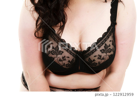 Plus size woman wearing bra lingerie 122912959