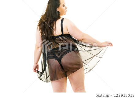 Plus size woman in lingerie tunic Plus size woman in lingerie tunic 122913015