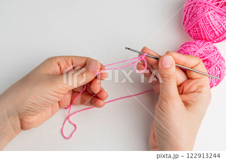 Crochet magic ring with pink yarn  122913244