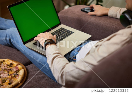 male hands typing on laptop keyboard at home, close-up male hands typing on laptop keyboard at home, close-up 122913335