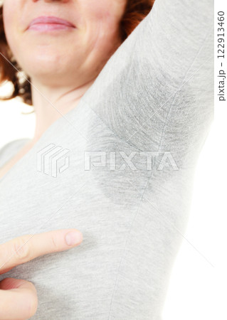 Sweaty woman wet stain under arm 122913460