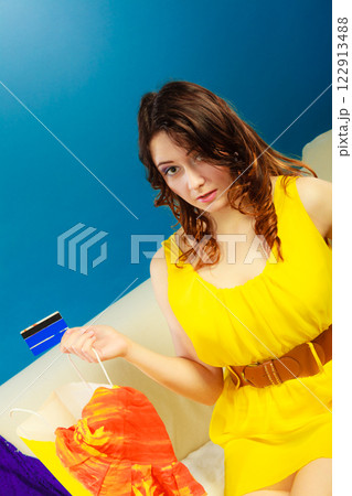 Woman with credit card doing shopping 122913488