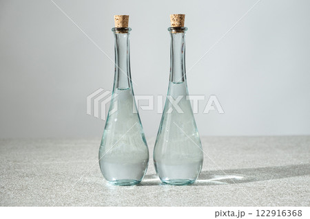 Classic white distilled vinegar in a narrow-spout vinegar bottles with a corks Classic white distilled vinegar in a narrow-spout vinegar bottles with a corks 122916368