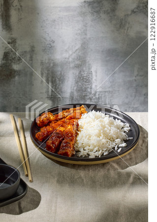 fried chicken in garlic sauce with rice 122916687