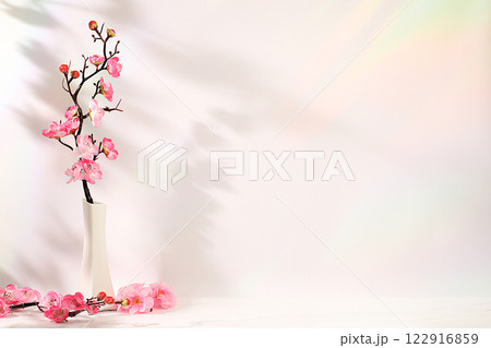 Abstract spring flower arrangement with cherry blossom branches in vase,elegant beauty concept,stage for product display and business concept.Minimal modern aesthetics Abstract spring flower arrangement with cherry blossom branches in vase,elegant beauty concept,stage for product display and business concept.Minimal modern aesthetics 122916859
