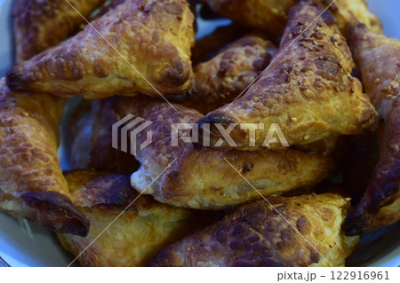 Golden-Brown Triangular Pastries Freshly Baked 122916961