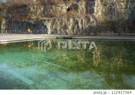 Swimming pool with dirty green water close-up. Swimming pool with dirty green water close-up. 122917564