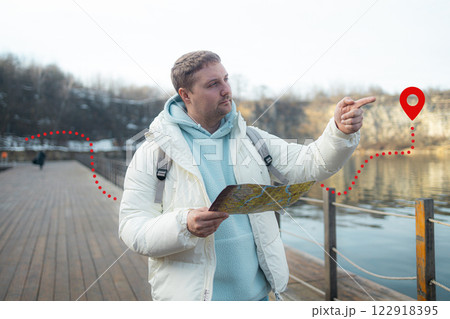 Male hiker reading map hiking trip looking to find place to go. Search, map and man lost in forest with guide to camp in woods or thinking of navigation or direction. Male hiker reading map hiking trip looking to find place to go. Search, map and man lost in forest with guide to camp in woods or thinking of navigation or direction. 122918395