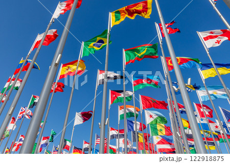Many world's countries national flags waving on the wind, with Brazilian, Moorish, Sri Lancan Azerbaijani banners in the foreground, Doha, Qatar Many world's countries national flags waving on the wind, with Brazilian, Moorish, Sri Lancan Azerbaijani banners in the foreground, Doha, Qatar 122918875