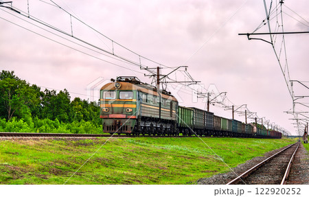 Soviet-built electric locomotive hauling a freight train near Siversk, currently an active war zone in Russo-Ukrainian War in Donetsk region of Ukraine 122920252