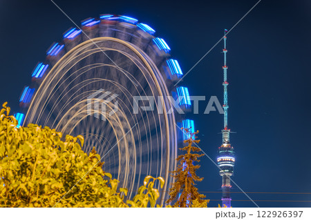 View of the 'Sun of Moscow' Ferris wheel located in VDNKh park in Moscow View of the 'Sun of Moscow' Ferris wheel located in VDNKh park in Moscow 122926397