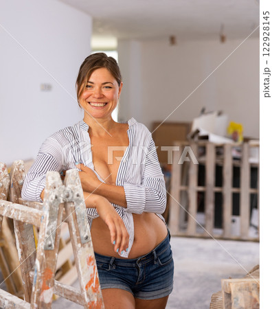 Sexy woman posing in building site Sexy woman posing in building site 122928145