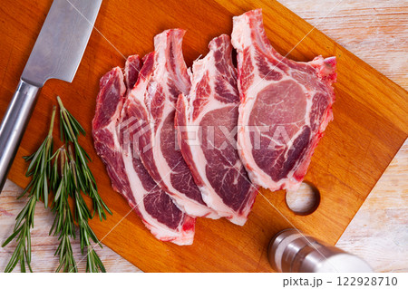 Raw pork chop Raw pork chop 122928710