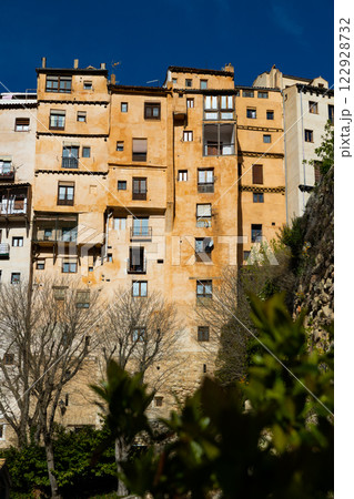 Ancient skyscrapers on hill above gorge in Spanish city of Cuenca Ancient skyscrapers on hill above gorge in Spanish city of Cuenca 122928732