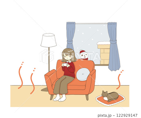 暖かい部屋で猫とくつろぐ女性 122929147