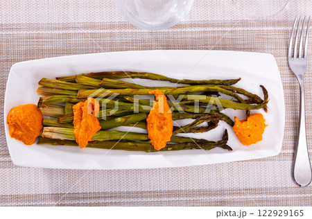Charred asparagus served with classic Romesco sauce Charred asparagus served with classic Romesco sauce 122929165
