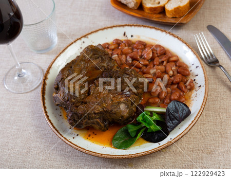 Tasty soft pork with stewed beans. Healthy food 122929423
