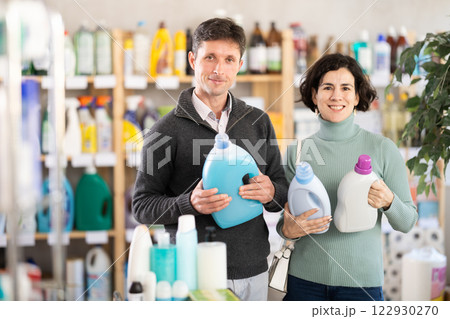 Married couple choosing detergent in the store Married couple choosing detergent in the store 122930270