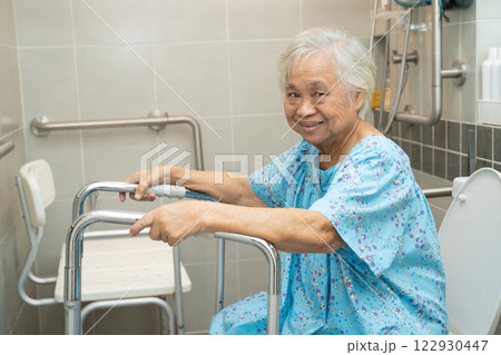 Asian elderly woman patient use walker and toilet bathroom handle security in nursing hospital, healthy strong medical. Asian elderly woman patient use walker and toilet bathroom handle security in nursing hospital, healthy strong medical. 122930447