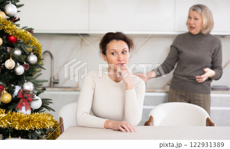 Elderly woman quarreling with adult woman 122931389