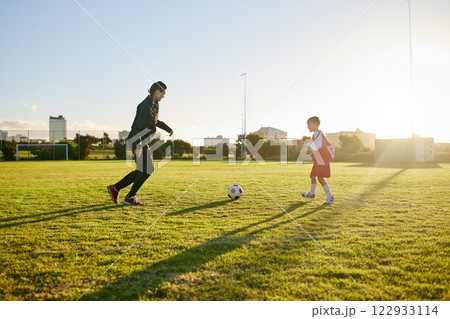 Fitness, soccer and coaching with girl and sports training with ball in park for goals, support and workout. Mentor, learning and motivation with child and coach training for football field exercise 122933114