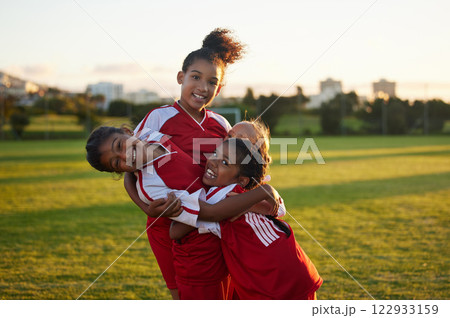 Soccer, friends and winner with team of children in park for fitness, collaboration and sports. Support, success and health with kids training on football field for exercise, games and celebration 122933159