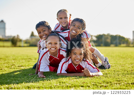 Soccer, training and children on sports field for football game, exercise or cardio together. Portrait of girl kids, athlete group and players with smile and partnership, teamwork and sport at school 122933225