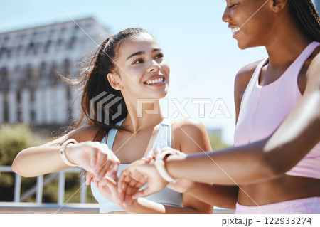 Watch, fitness motivation and friends running for cardio fitness in the city of Orlando together. African runner and women happy about sports training time on digital clock after workout in summer 122933274