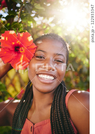 Beauty, flower and flare portrait of black woman happy, smile and enjoy Summer holiday or vacation in Jamaica. Happiness, skincare and wellness girl at peace, freedom or relax in outdoor nature park Beauty, flower and flare portrait of black woman happy, smile and enjoy Summer holiday or vacation in Jamaica. Happiness, skincare and wellness girl at peace, freedom or relax in outdoor nature park 122933347
