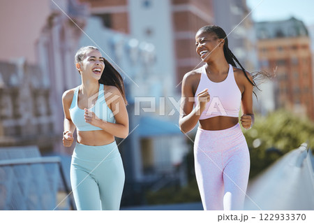 Fitness, women and city friends running in street on summer morning in Brazil. Health, urban exercise and girl time to workout and laugh, black woman and best friend or personal trainer run together. Fitness, women and city friends running in street on summer morning in Brazil. Health, urban exercise and girl time to workout and laugh, black woman and best friend or personal trainer run together. 122933370