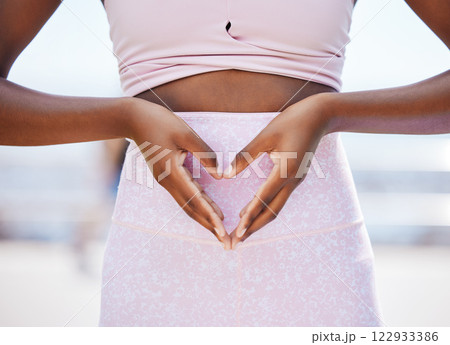 Fitness, health and hands of black woman with heart on stomach and sports training for wellness, hope and vision. Happy, exercise and trust with girl holding love sign on abdomen for goals training Fitness, health and hands of black woman with heart on stomach and sports training for wellness, hope and vision. Happy, exercise and trust with girl holding love sign on abdomen for goals training 122933386
