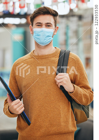 University student and covid portrait of man with face mask protection for virus transmission. Responsibility and respect of guy with corona cover for infection prevention at college campus. University student and covid portrait of man with face mask protection for virus transmission. Responsibility and respect of guy with corona cover for infection prevention at college campus. 122933530