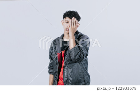 Tired and distressed people covering his face with his palm, Concept of a bored and tired man 122933679