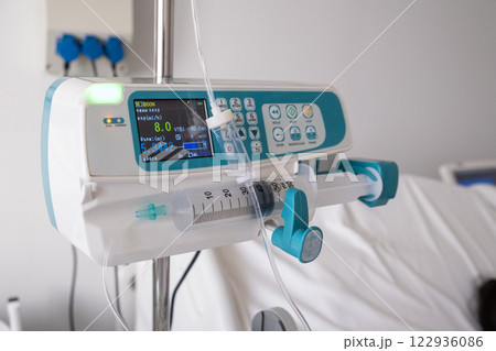 Hospital Room with Infusion Pump and Patient 122936086